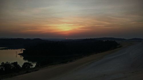 Scenic view of silhouette landscape against sky during sunset