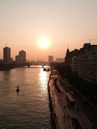 City buildings against sky during sunset