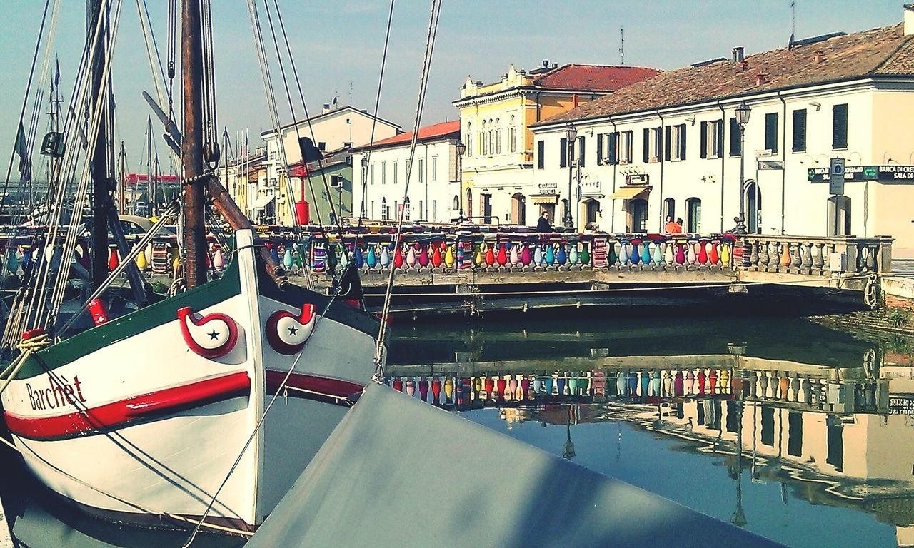 VIEW OF CANAL BY BUILDINGS AGAINST SKY