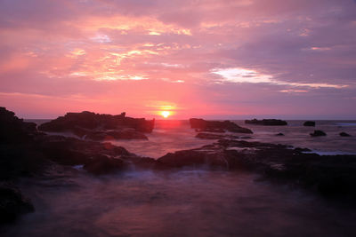Scenic view of sea against sky at sunset