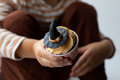 Midsection of woman holding food