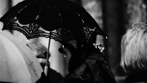 Close-up of woman with umbrella