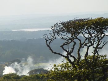 Scenic view of mountain against cloudy sky