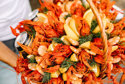 High angle view of various fruits in plate on table