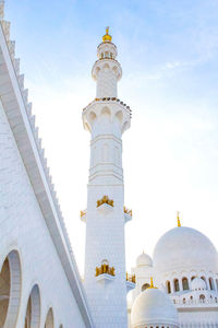 Low angle view of bell tower against sky