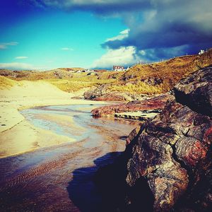 Scenic view of beach against sky