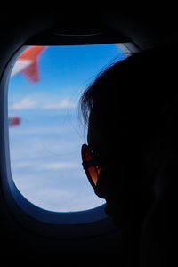 Close-up of sunglasses against sky