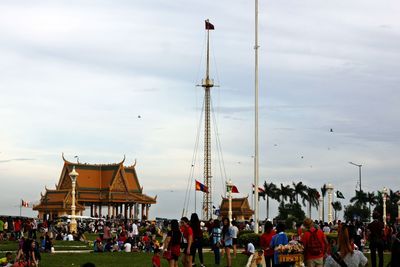 People at town square against sky