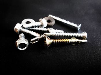 High angle view of equipment on table against black background