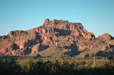 Scenic view of rocky mountains against clear blue sky