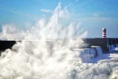 Water splashing against sky