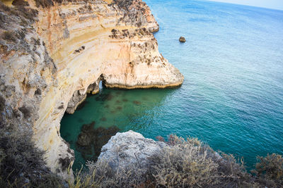 High angle view of rock formation in sea