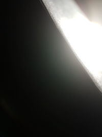 Close-up of airplane window against sky