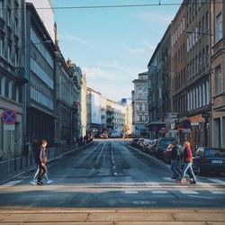 People walking on road in city