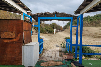 Wood building built on the beach, deserted and desolate beach in winter time.