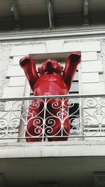 Close-up of red shoes on window at home