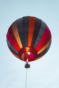 Low angle view of hot air balloons against sky