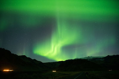 Scenic view of landscape against sky at night