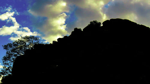 Low angle view of silhouette trees against sky during sunset