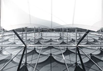 Low angle view of ferris wheel against sky