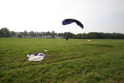 People on field against clear sky