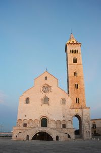 Low angle view of clock tower against clear sky