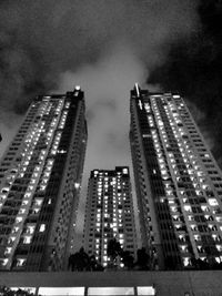 Low angle view of skyscrapers lit up at night