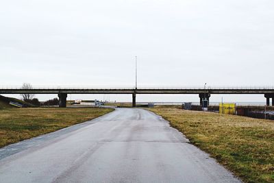 Highway by road against sky