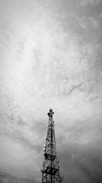 Low angle view of communications tower against sky