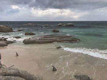 High angle view of rocks on beach against sky