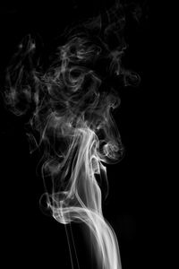 Close-up of smoke against black background