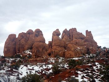 Rock formations on landscape against sky