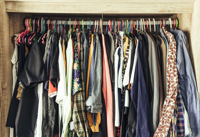 Various clothes hanging in rack