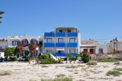 Residential buildings against blue sky