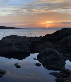 Scenic view of sea against sky at sunset