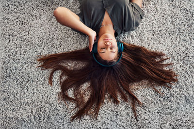 Portrait of young woman lying down