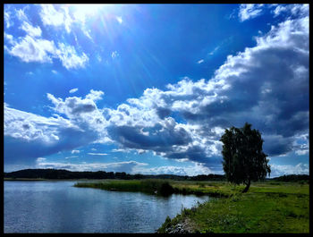 Scenic view of landscape against cloudy sky