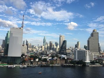 Modern buildings in city against sky