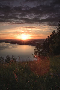 Scenic view of sunset over lake