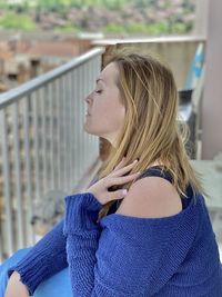 Side view of young woman looking away