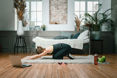 Woman relaxing on chair at home