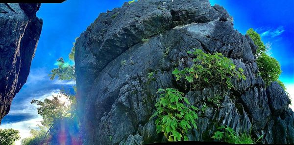 Low angle view of rock formation against sky