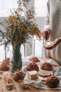 Man holding food on table