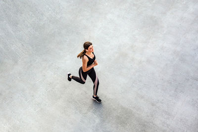 Full length of woman running