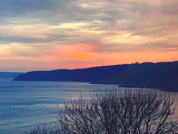 Scenic view of sea against orange sky