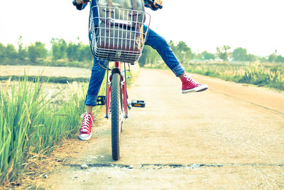 Low section of boy on bicycle