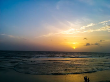 Scenic view of beach against sky during sunset