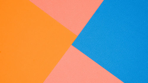 High angle view of multi colored pattern on orange wall