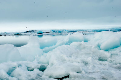 Scenic view of frozen sea against sky