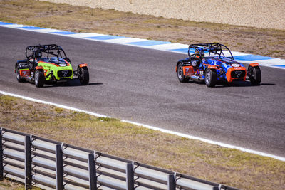 Race cars on track racing